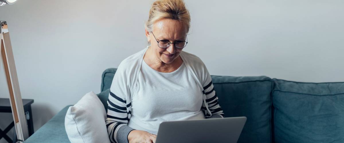 Elderly woman using a computer