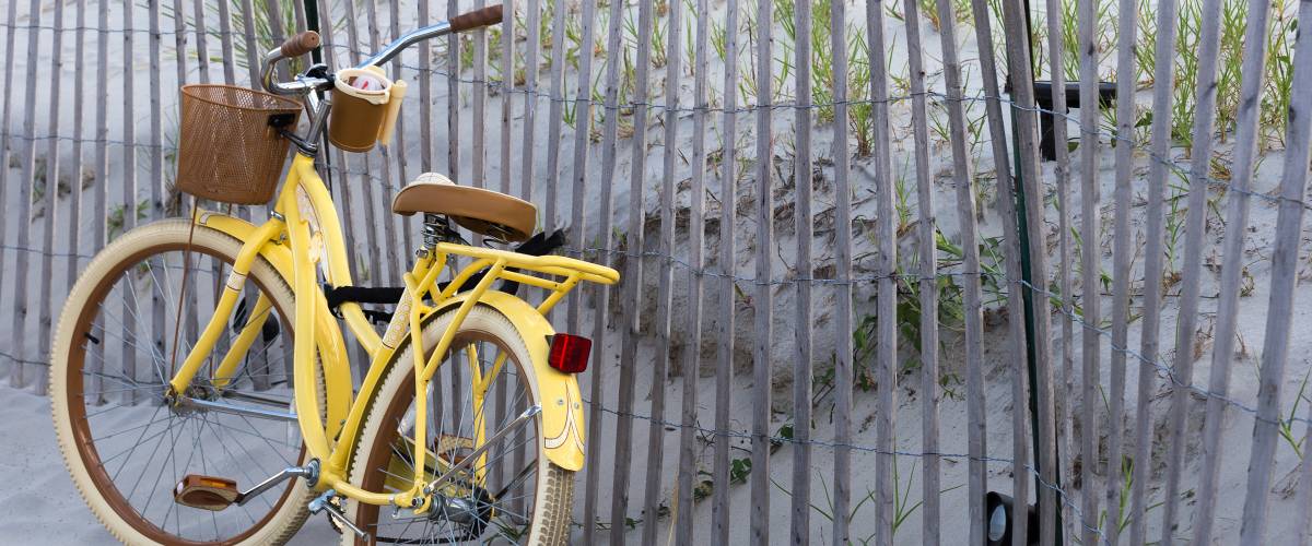 Vintage yellow bicycle on beach