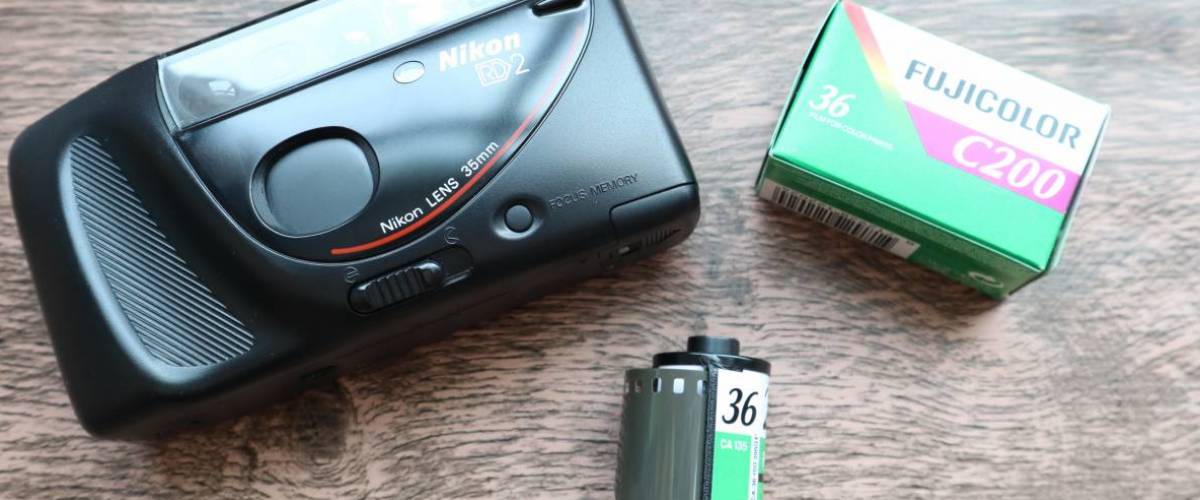 Nikon film camera and rolls of film