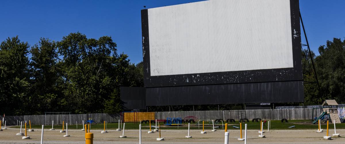 Drive in movie theatre screen and parking spots