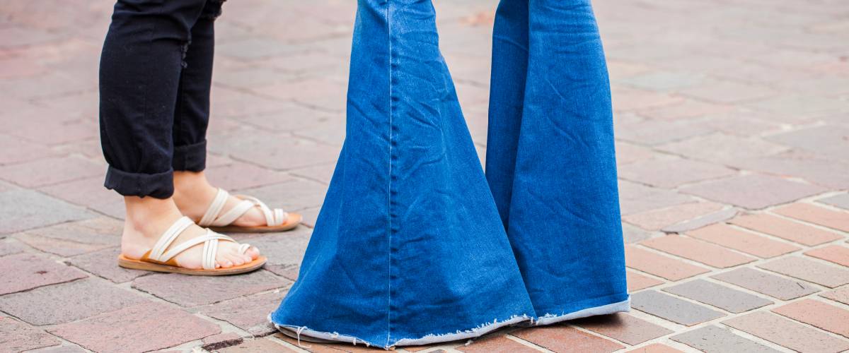 Person wearing bell bottom jeans