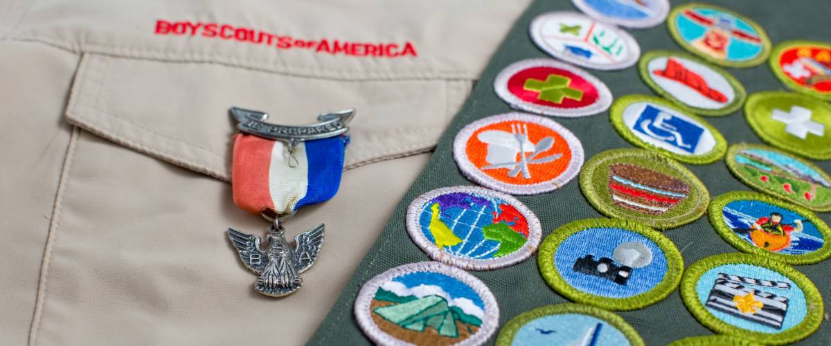 SAINT LOUIS, UNITED STATES - OCTOBER 16, 2017: Eagle pin and merit badge sash on Boy Scouts of America (BSA) uniform