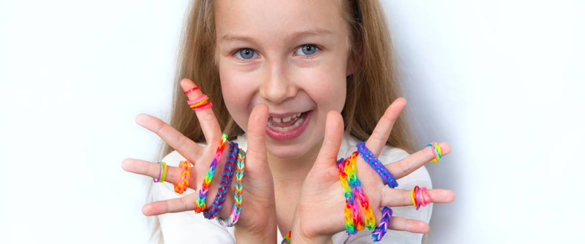 child with lots of fun jewelry on
