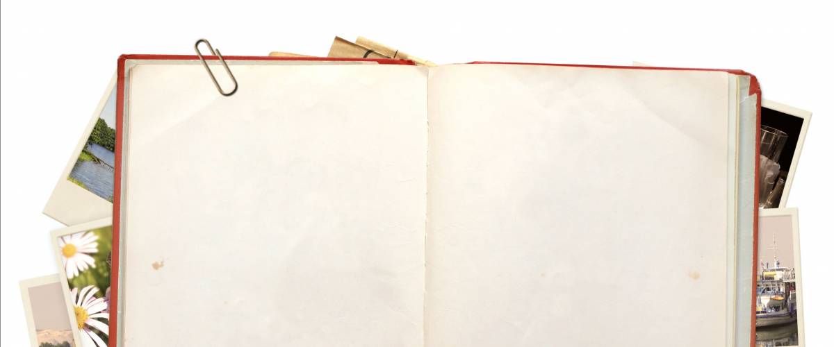 Old book and photos. Objects isolated over white