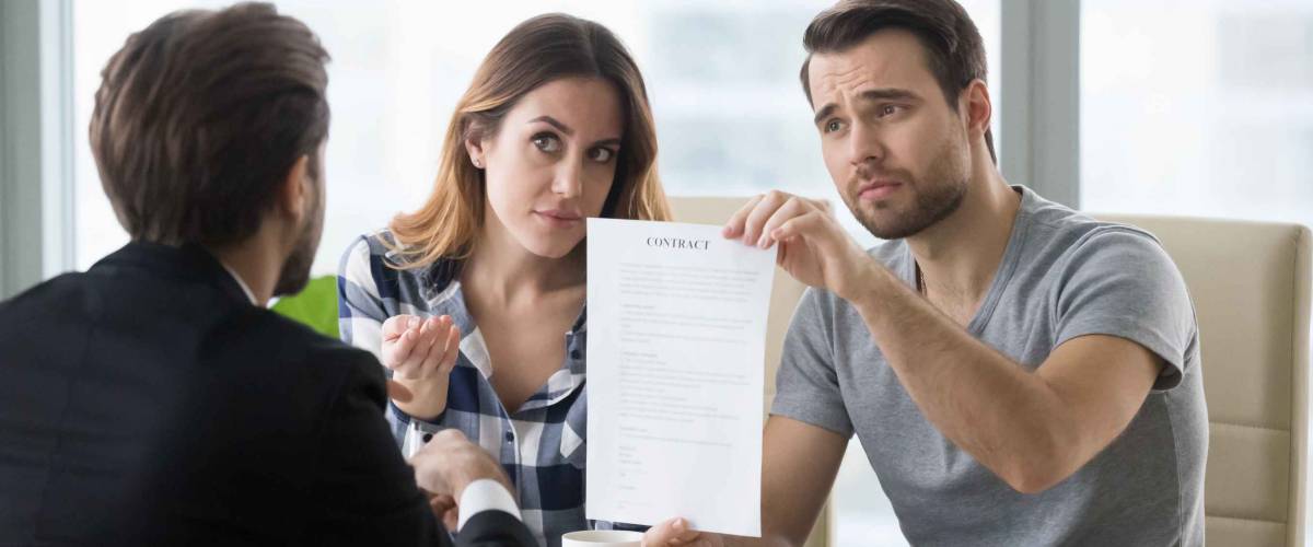 Young skeptic couple meet lawyer dissatisfied with terms of suspicious contract