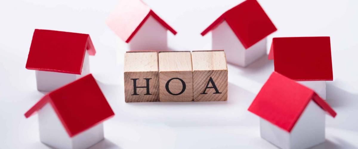 Homeowner Association Wooden Blocks Surrounded With Miniature House Models
