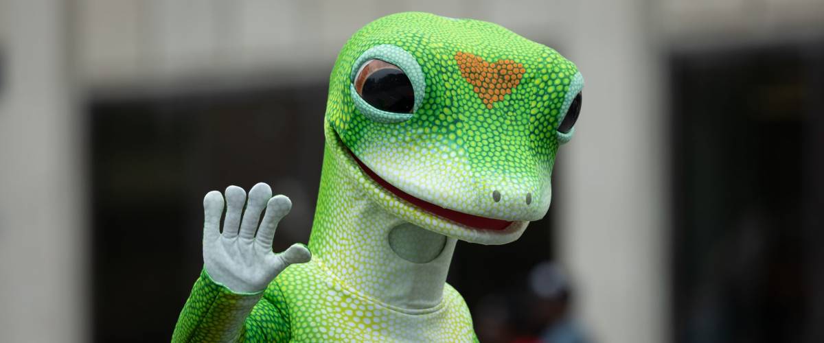 Indianapolis, Indiana, USA - September 22, 2018: The Circle City Classic Parade, Man wearing the Geico Gecko insurance mascot outfit