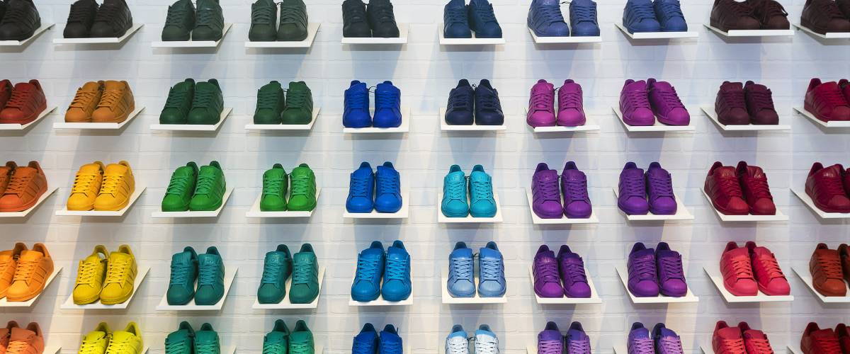 Wall of different colorful shoes for sale