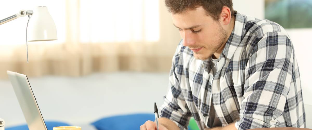 Man working on homework at desk