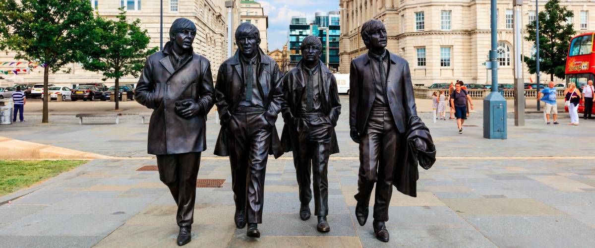LIVERPOOL, UK - AUGUST 18, 2016: Bronze statue of the four Liverpool Beatles stands on Liverpool Waterfront by sculptor Andrew Edwards