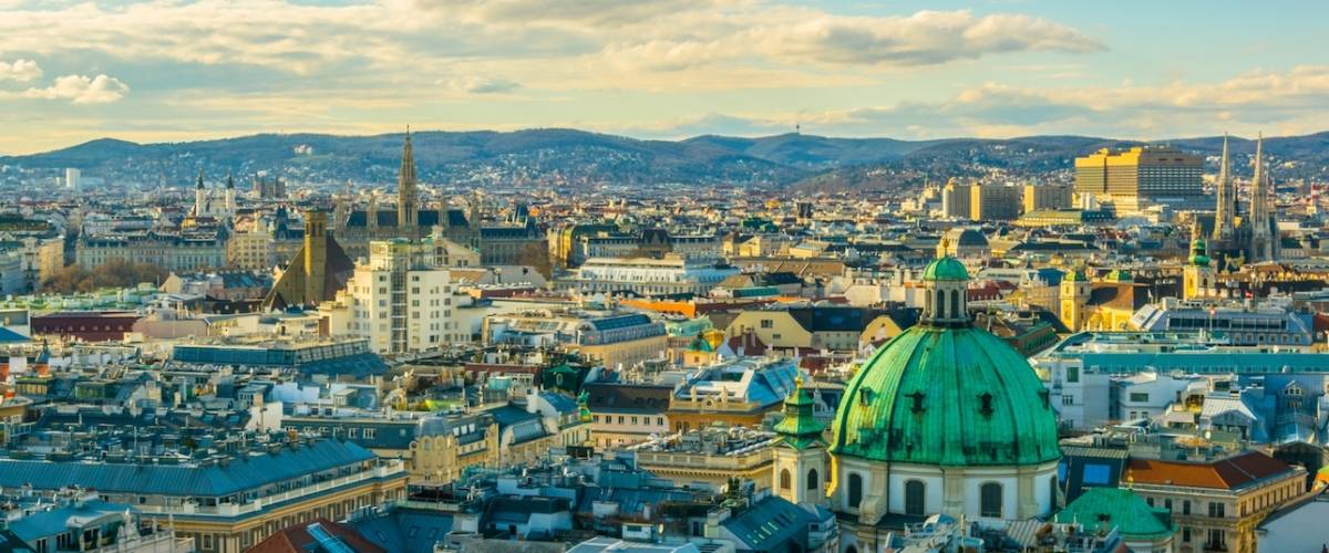 Aerial view of Vienna with tower of the town hall building, votivkirche and peterskirche churches from the stephansdom cathedral.