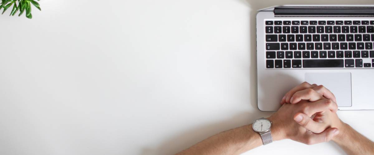 Man waiting patiently by his laptop