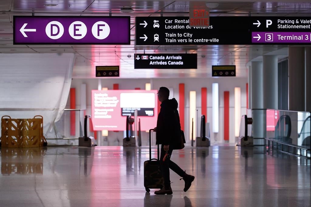 More than 800 airline food service staff at Toronto&#039;s Pearson airport have gone on strike, potentially leaving thousands of passengers without meals. Travellers make their way through Pearson