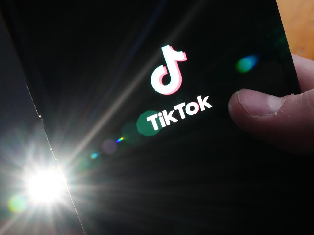 TikTok is testing an app that rivals Instagram in Canada. The TikTok startup page is displayed on an iPhone in Ottawa, Monday, Feb. 27, 2023. 