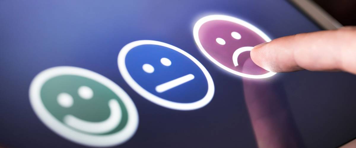 Unhappy and disappointed customer giving low rating and negative feedback in survey, poll or questionnaire. Sad and dissatisfied man giving review about service quality. Bad user experience.