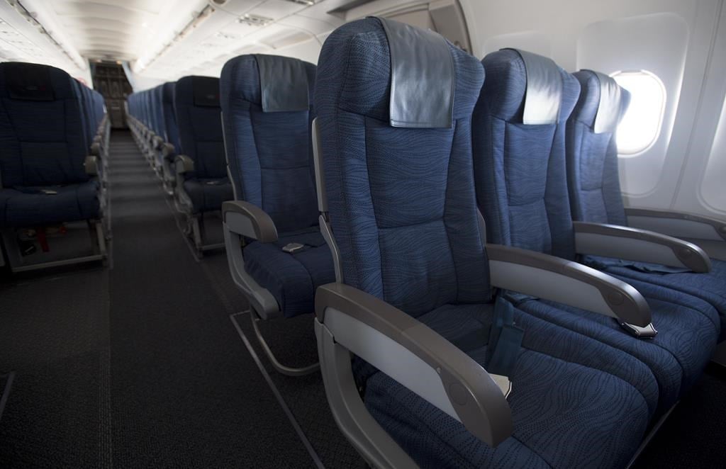 Air Canada is pressing pause on a new seat selection fee after social media backlash against the days-old policy. Airline seats are seen during a flight from Vancouver to Calgary on Tuesday, 