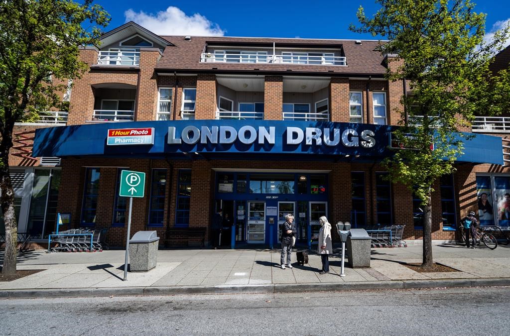 People wait outside of the London Drugs Kerrisdale location on Monday, April. 29, 2024. London Drugs says it is gradually reopening its stores following a cybersecurity incident that&#039;s shut a