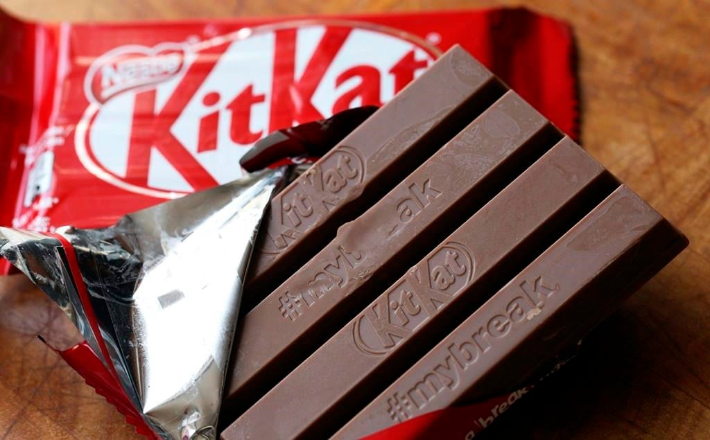 A Kit Kat chocolate bar is photographed Wednesday July 25, 2018, in Rugby, England. Hundreds of Nestle workers walked off the job in Toronto on Sunday after their union said the company would