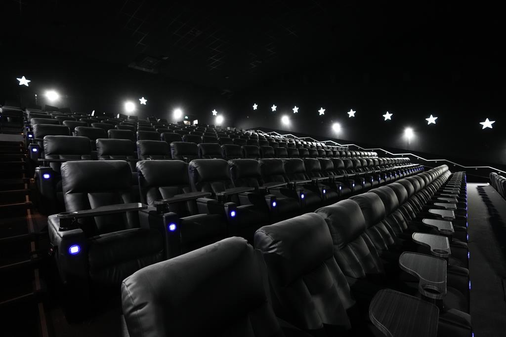 Cineplex Inc. reported a profit in its latest quarter compared with a loss a year ago as its results were boosted by the sale of its arcade game business. Theatre seats are shown at Cineplex 