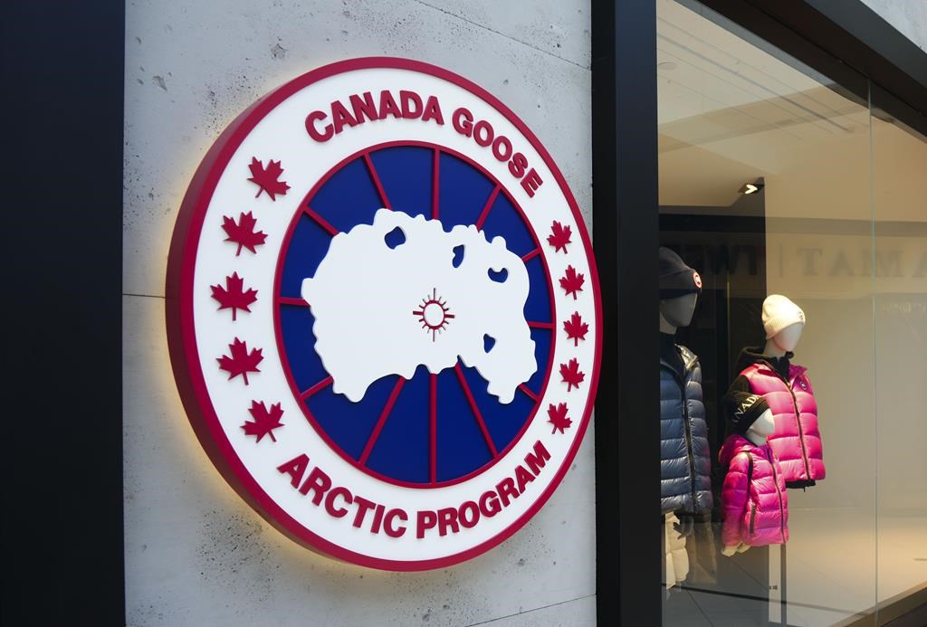 Canada Goose Holdings Inc. reported a profit in its fourth quarter compared with a loss a year earlier as its revenue rose 22 per cent. A Canada Goose logo is shown on a storefront in Ottawa 