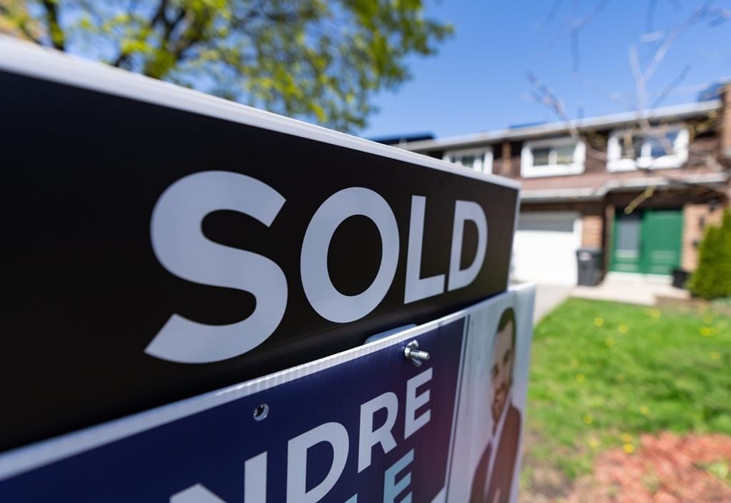 The Teranet-National Bank composite house price index which tracks home prices in 11 of Canada&#039;s largest cities remained stable from March to April. A real estate sign is posted outside a hom