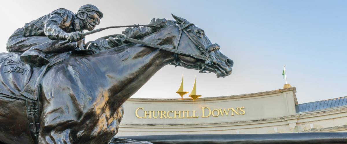 LOUISVILLE, KENTUCKY, USA - MAY 15 2016: Entrance to Churchill Downs featuring a statue of 2006 Kentucky Derby Champion Barbaro.