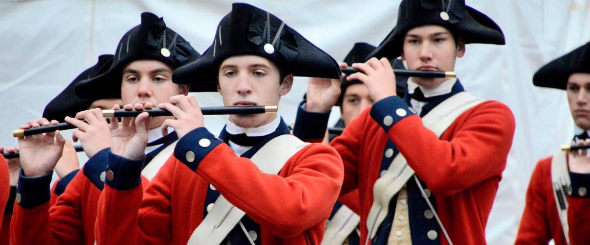 WILLIAMSBURG, VIRGINIA – October 6, 2012: The Colonial Williamsburg Fife and Drum Corp performs on Duke of Gloucester Street.
