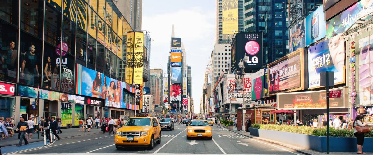 NEW YORK CITY - JUNE 28: Taxi cars in Times Square, a busy tourist intersection of commerce Advertisements and a famous street of New York City and US, seen on June 28, 2012 in New York, NY.