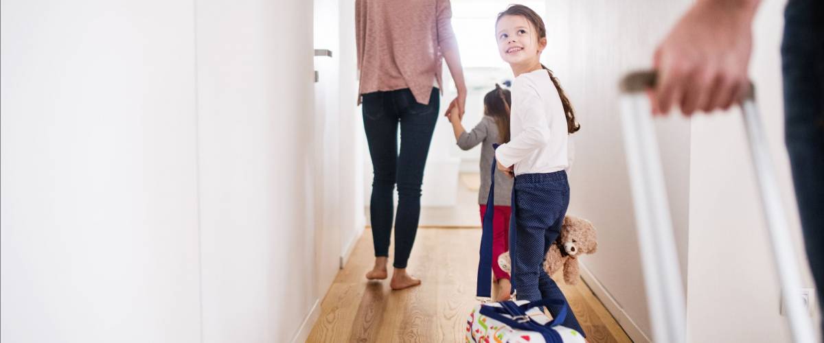 Young family with two children going on a holiday.