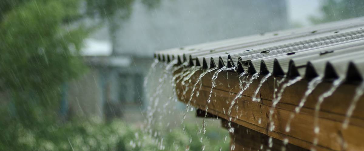 rain flows down from a roof