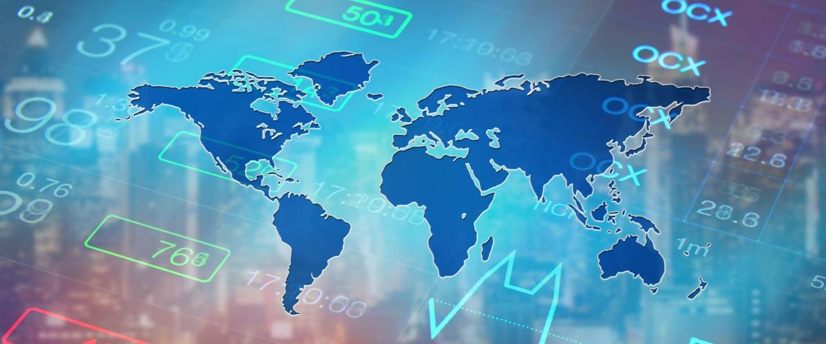 digital world map over a photo of the stock market