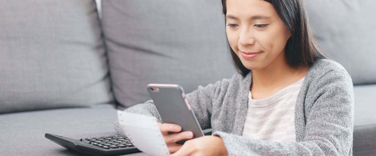 Woman counting expense of daily life
