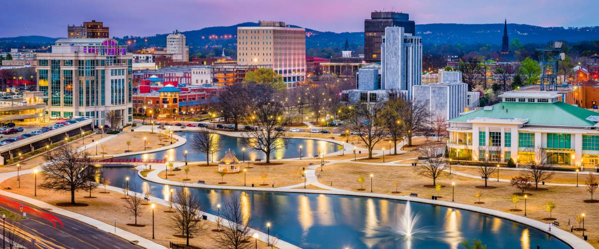 Huntsville, Alabama, USA park and downtown cityscape at twilight.