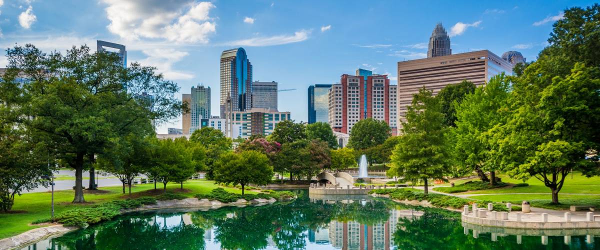 The skyline of Uptown Charlotte, and lake at Marshall Park, in Uptown Charlotte, North Carolina.
