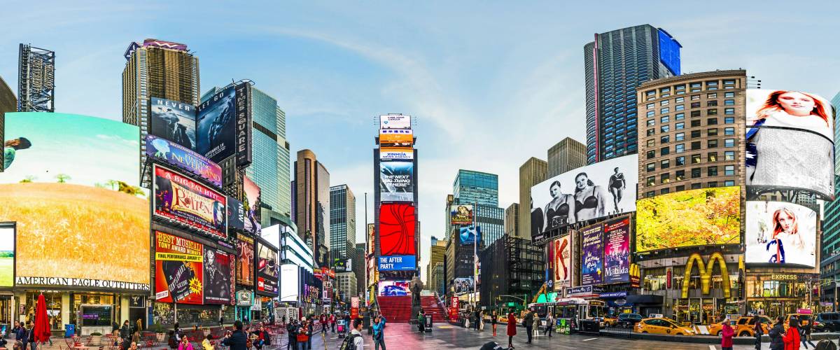 NEW YORK, USA - OCT 21, 2015: people visit Times Square, featured with Broadway Theaters and huge number of LED signs, is a symbol of New York City and the United States.