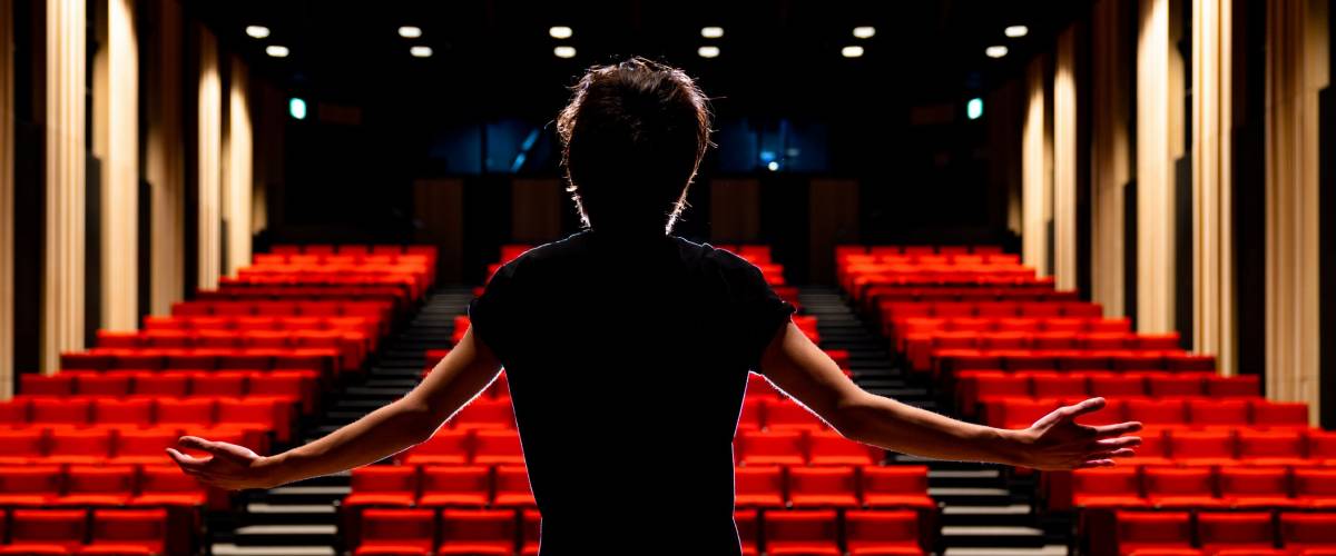 Young actor in a theater.