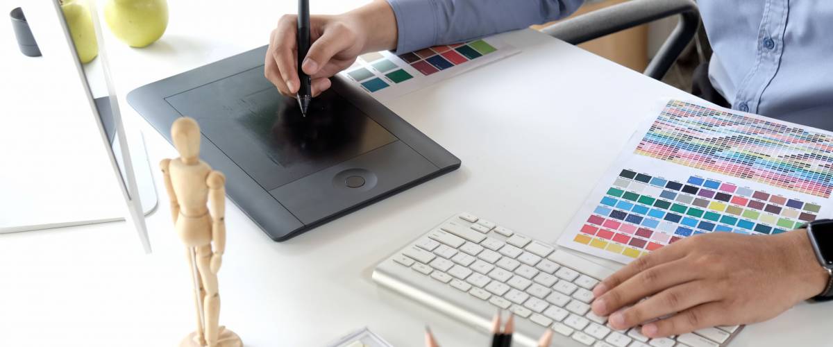 art student working on graphic design tablet