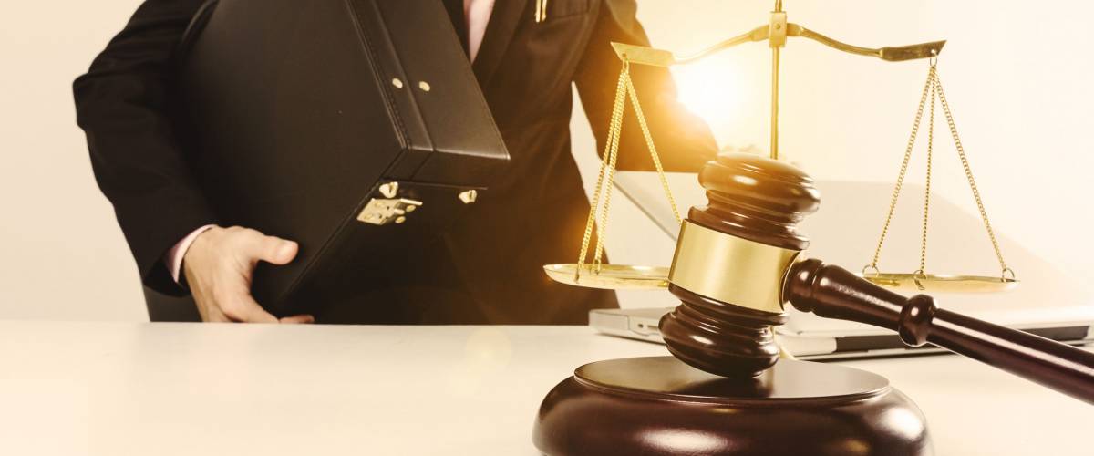 gavel, scales, and lawyer with briefcase. Lawyer conceptual.