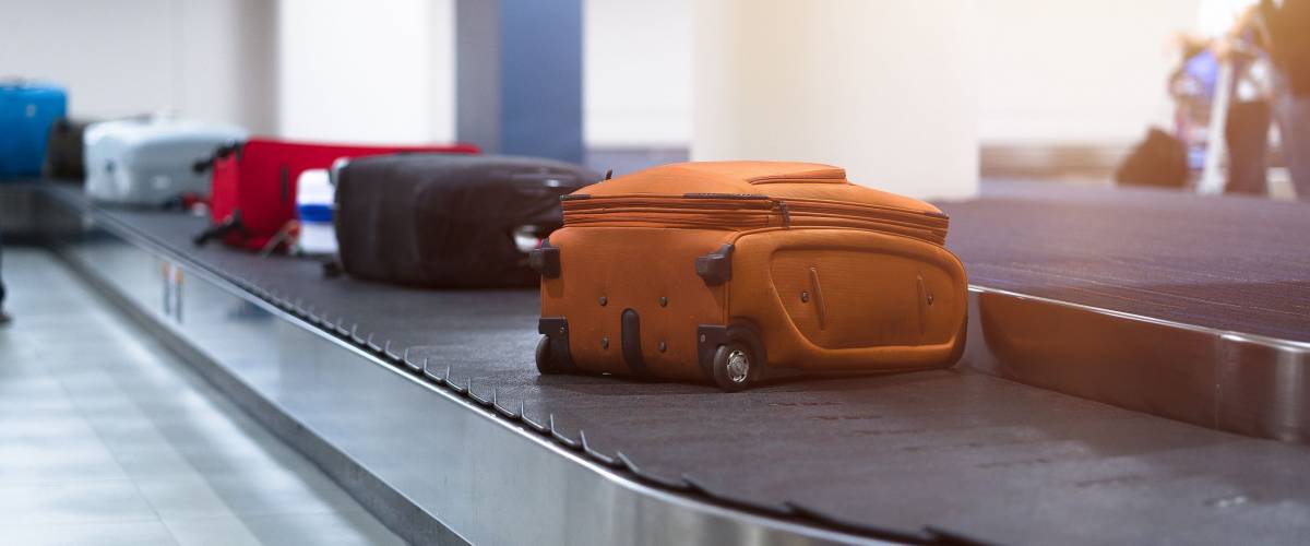 luggage bags on a carousel at airport