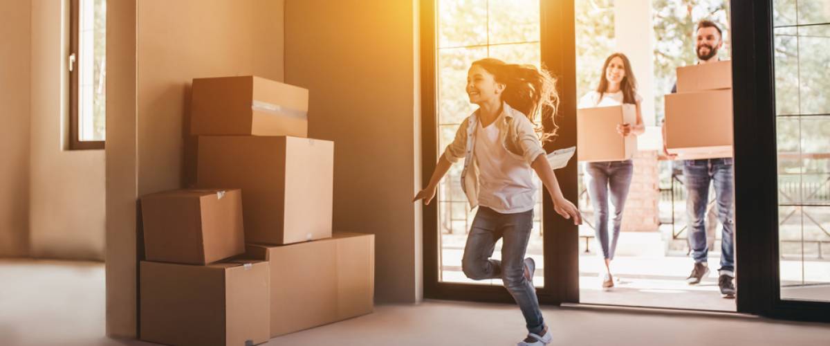young family moving day into new house