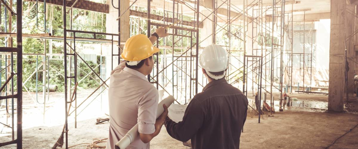 two builders working on a home
