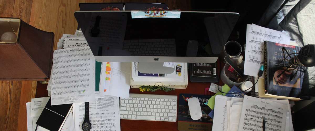 Cluttered desk workstation