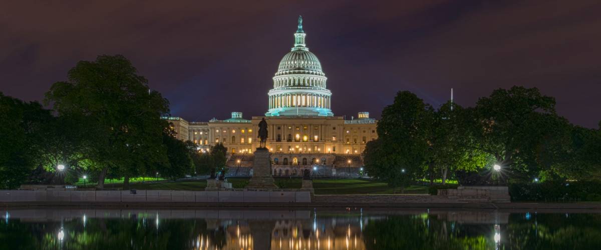 US Capital building taken at night reflecting off of capital pond.