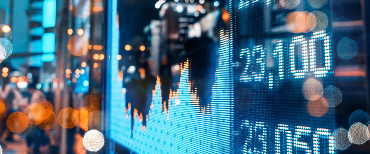 Display of Stock market quotes with city scene reflect on glass