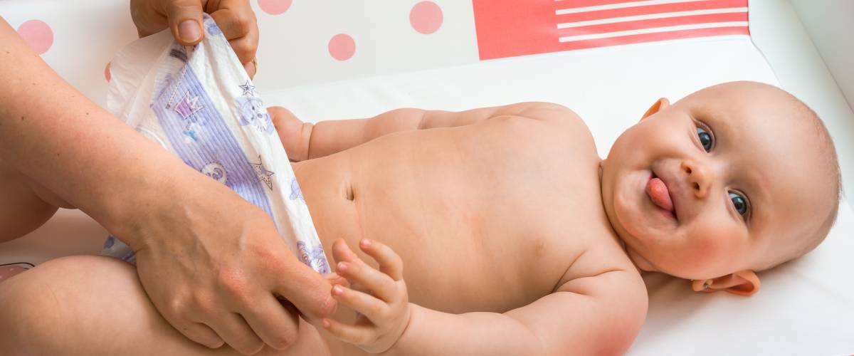 Baby undergoing a diaper change