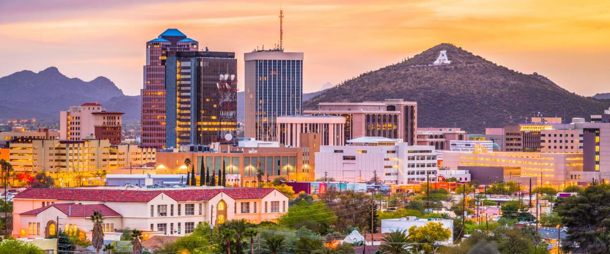 Tucson, Arizona, USA downtown skyline with Sentinel Peak at dusk.
