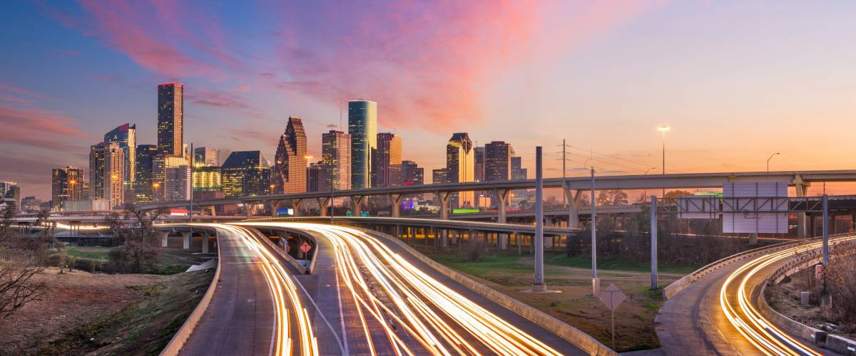 Houston, Texas, USA downtown skyline over the highways at dusk.