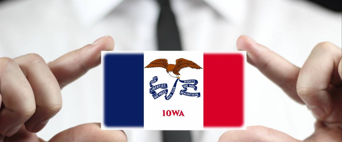 Businessman holding a business card with Iowa State Flag