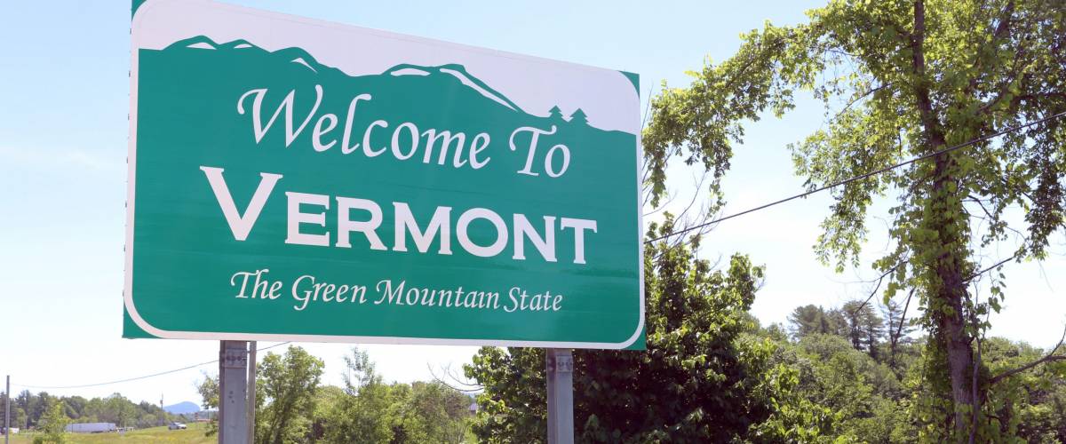 A welcome sign at the Vermont state line.