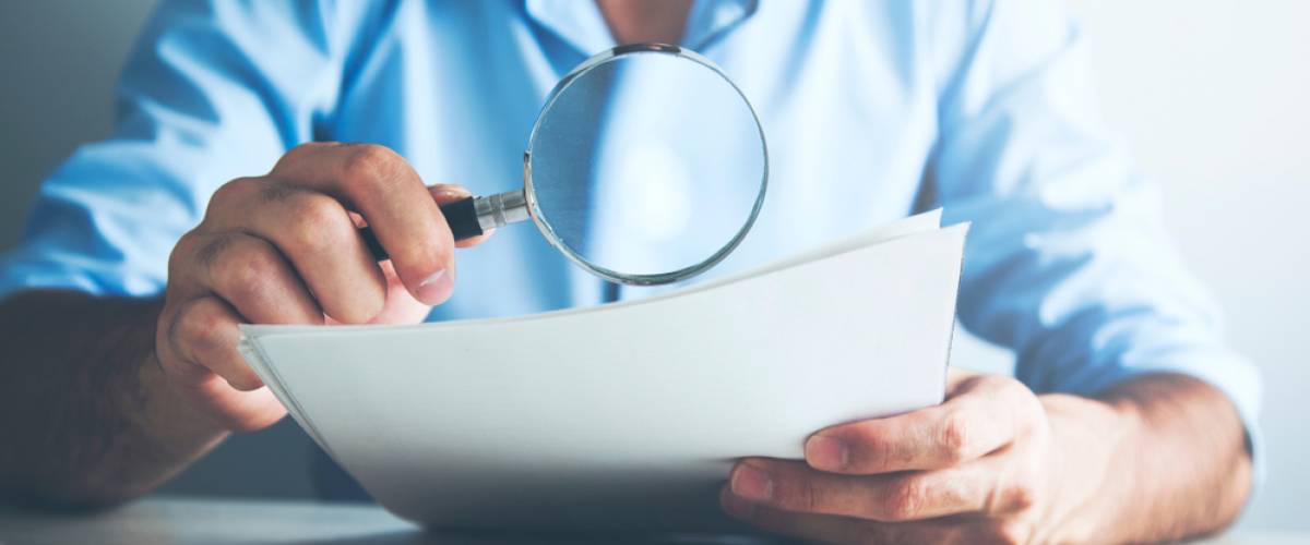 reading fine print with magnifying glass